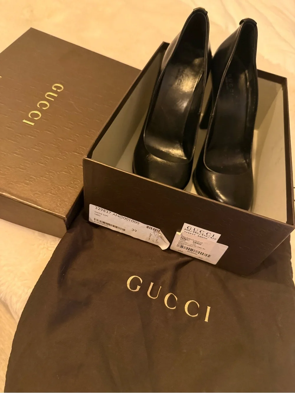 Authentic Gucci Black Leather Pumps with Gold GG logo